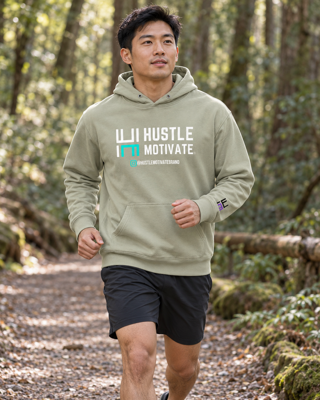 AI lifestyle mockup of the Dusty Sage Hustle Motivate hoodie worn on a woodland trail.