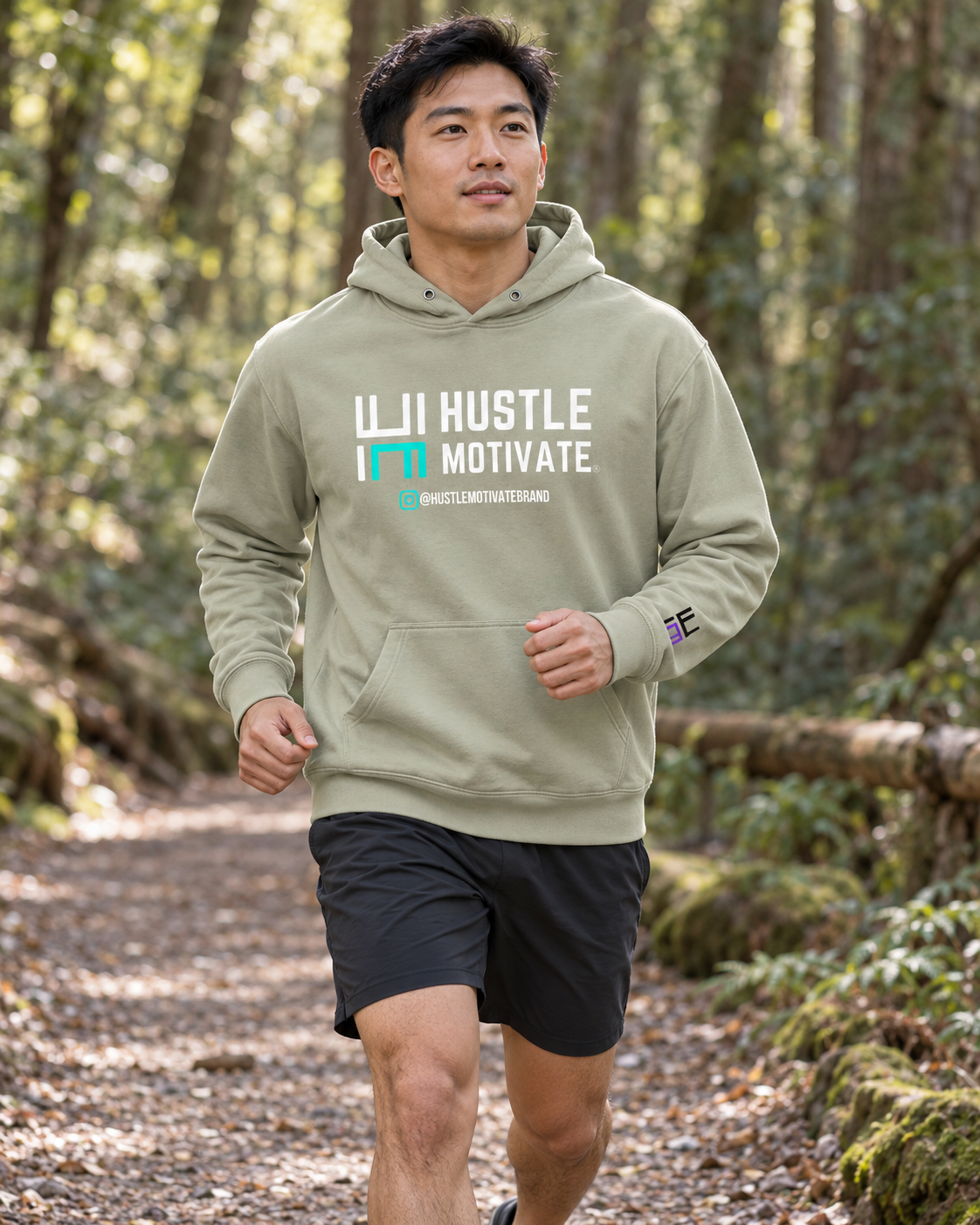 AI lifestyle mockup of the Dusty Sage Hustle Motivate hoodie worn on a woodland trail.