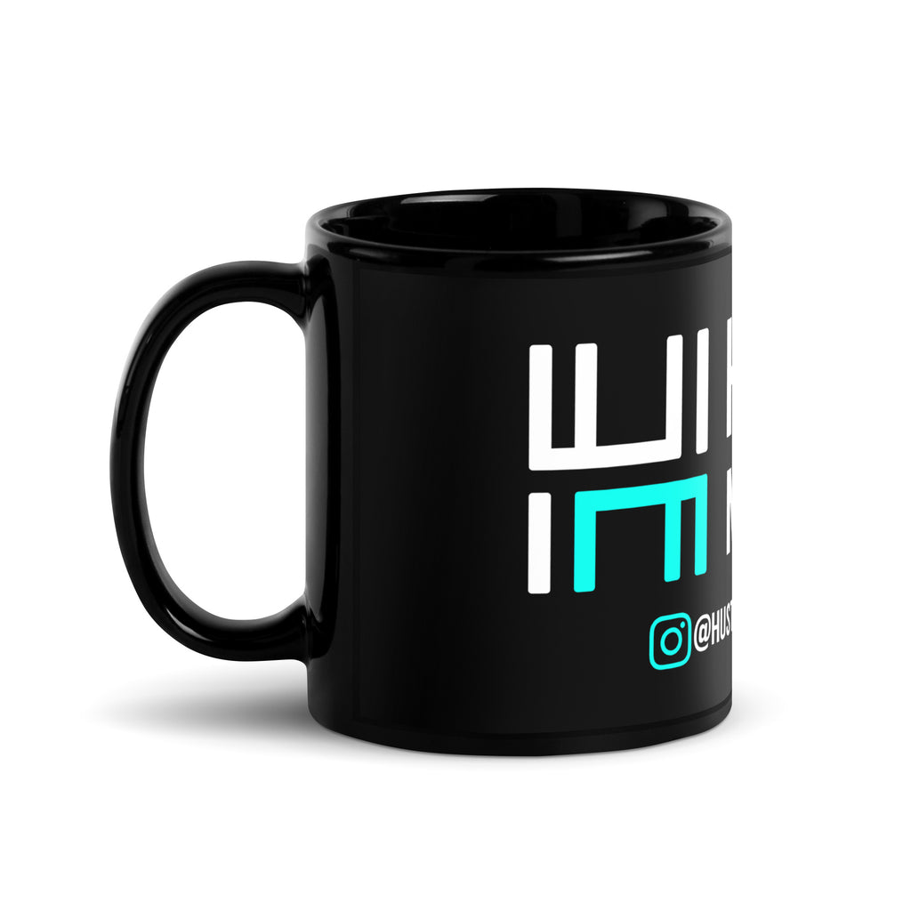 Hustle Motivate glossy black ceramic mug with white and teal artwork, 11 oz, handle on the left.