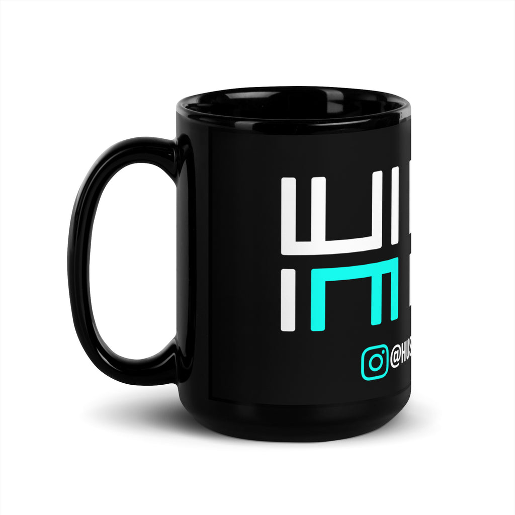 Hustle Motivate glossy black ceramic mug with white and teal artwork, 15 oz, handle on the left.