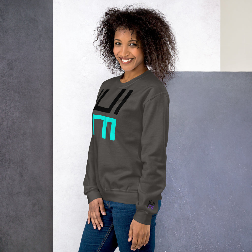 Model wearing the Hustle Motivate Statement Crewneck in charcoal, showing the front print and embroidered left sleeve